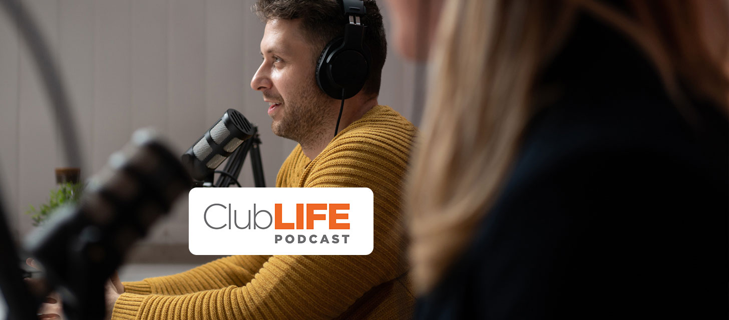 A man wearing headphones speaks into a microphone, with a 'ClubLIFE PODCAST' logo overlay. Another person is partially visible.