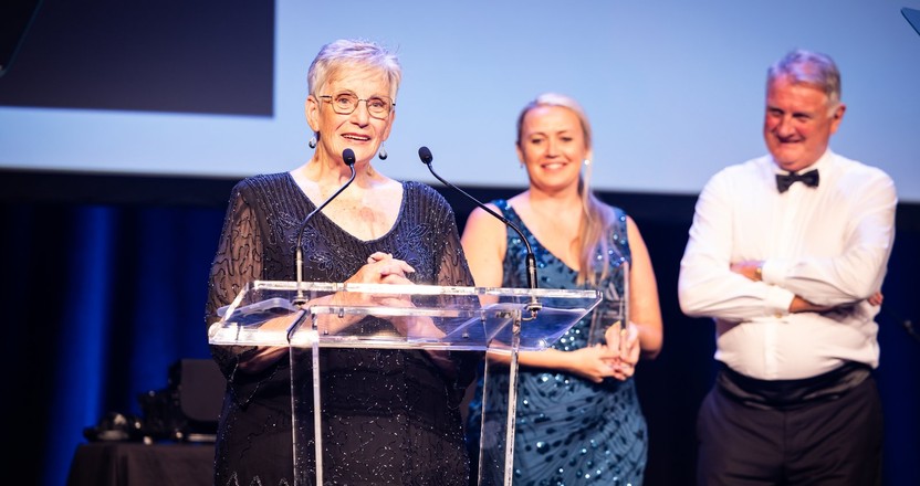 Woman on stage accepting award